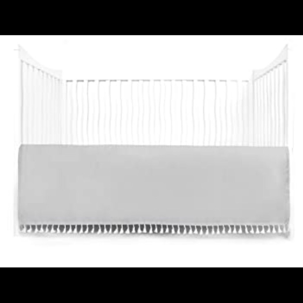 Crib skirt with tassels